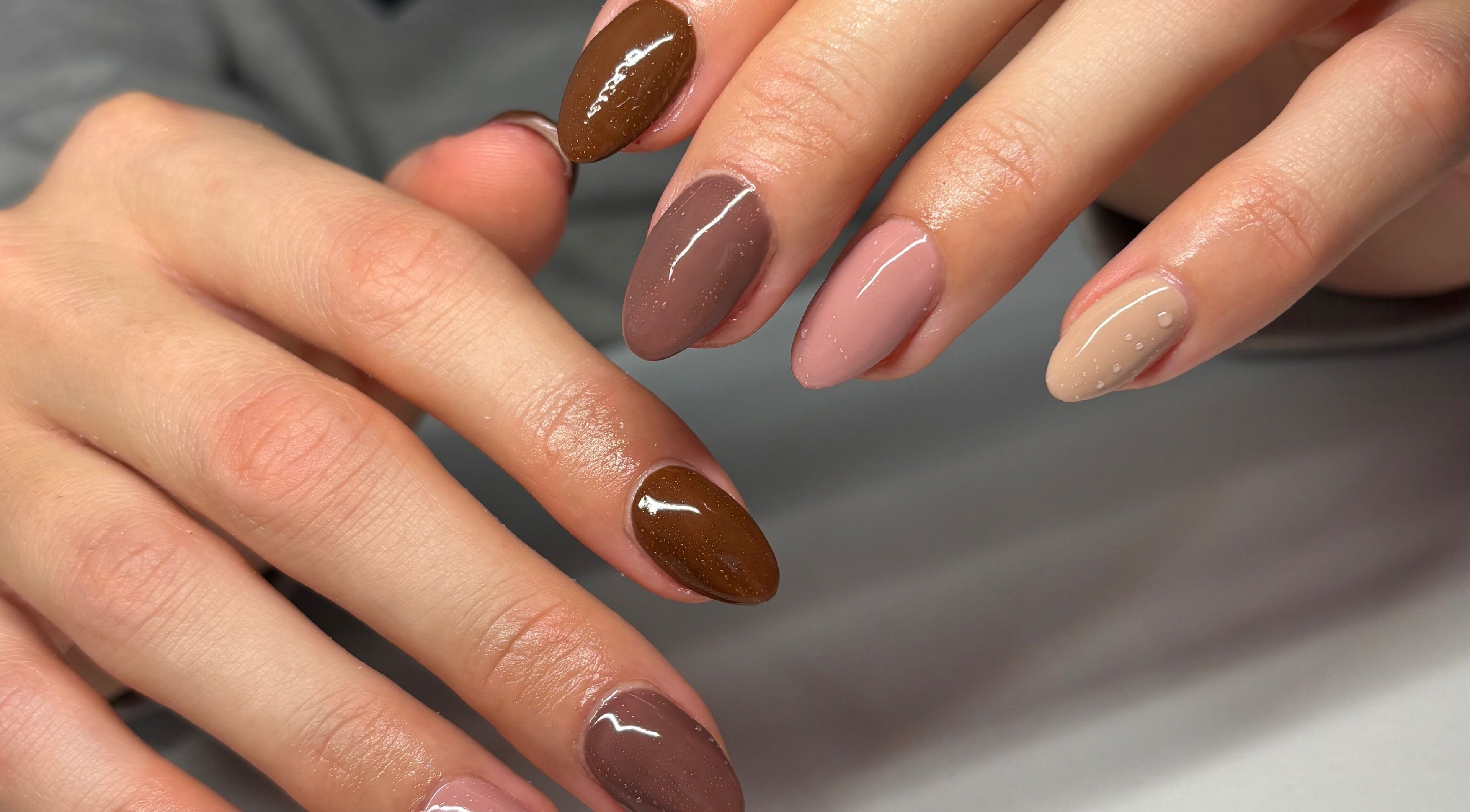 Elegant manicure with earthy tones at Nails by Em, Gloucester, England, GB.