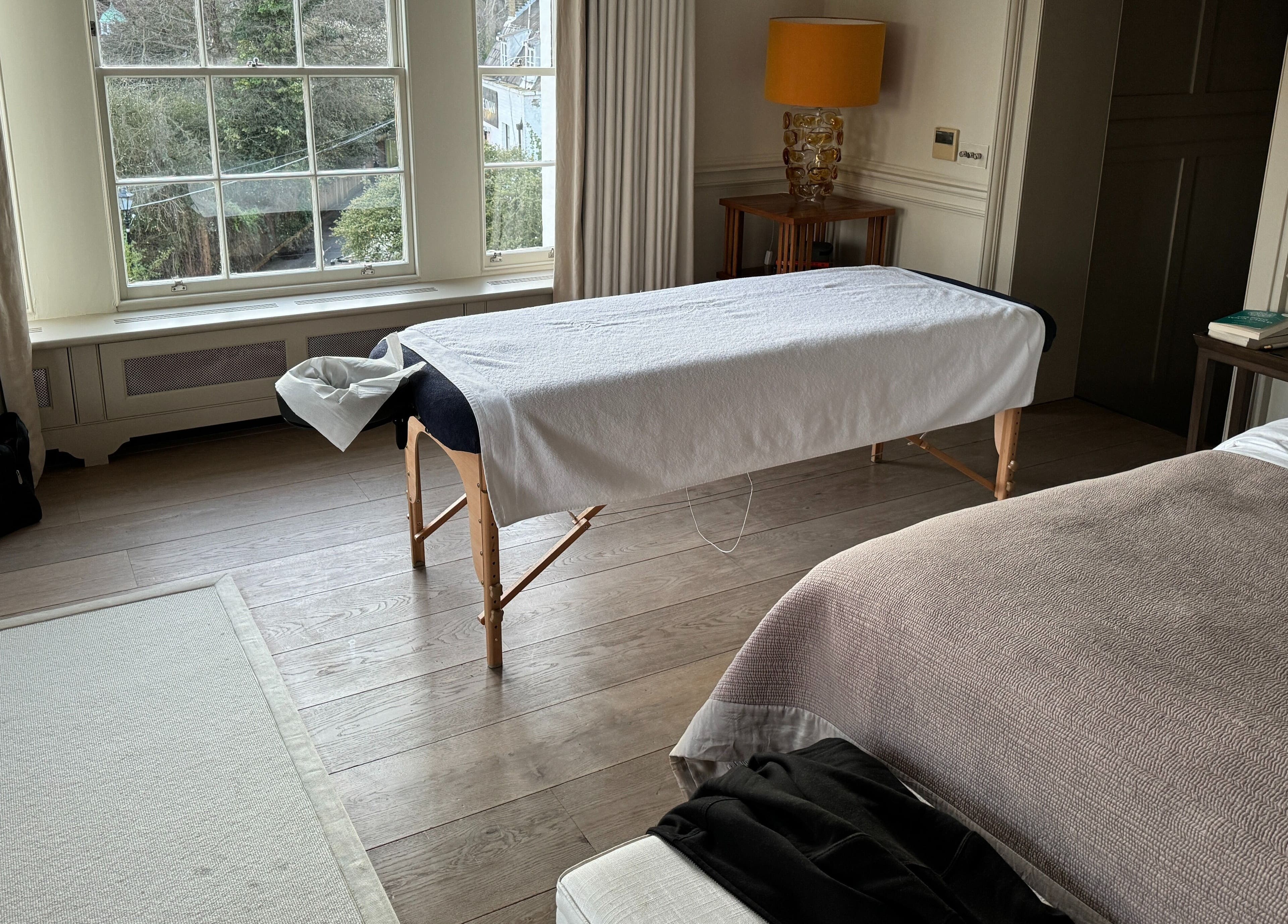 Massage table set in a serene room for Paul Massage at Home, Home Service, GB.