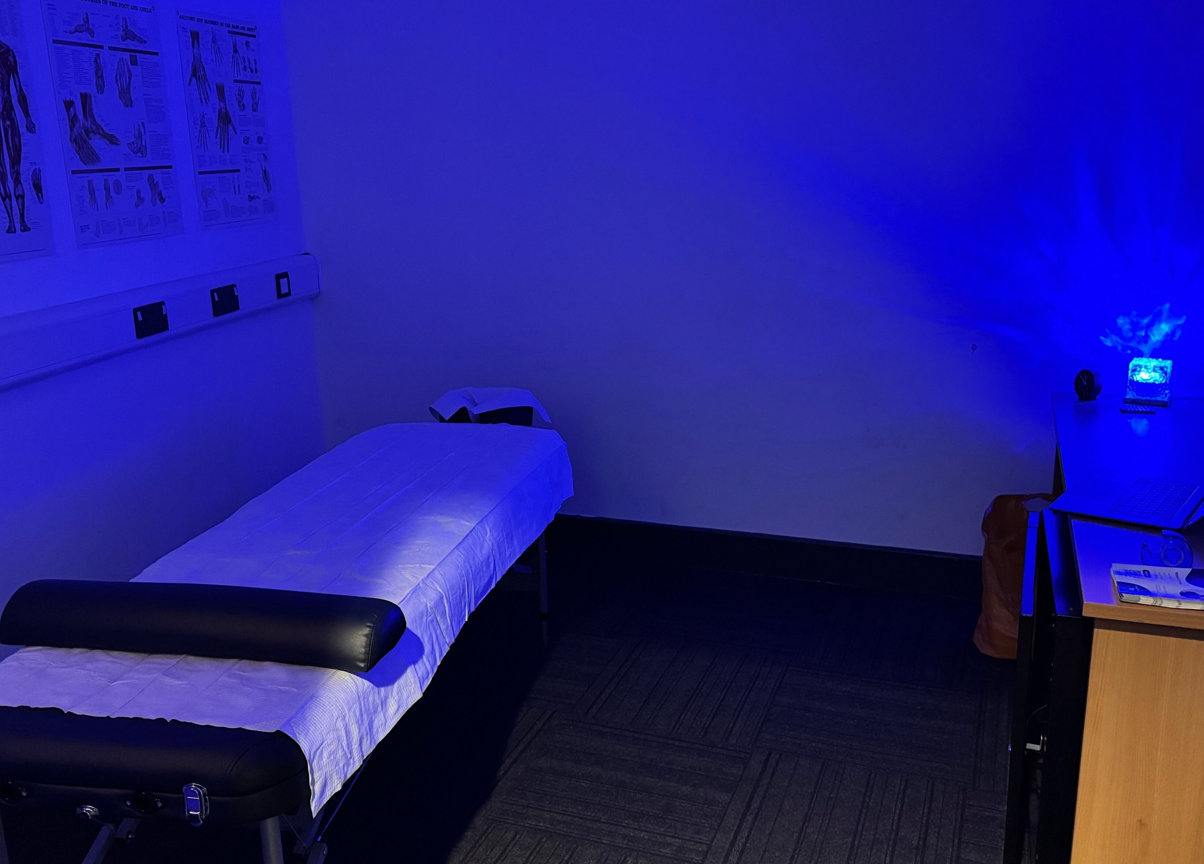 Relaxing massage room at Paul Massage, Langley Leisure Centre, Slough, England, GB with blue ambient lighting.