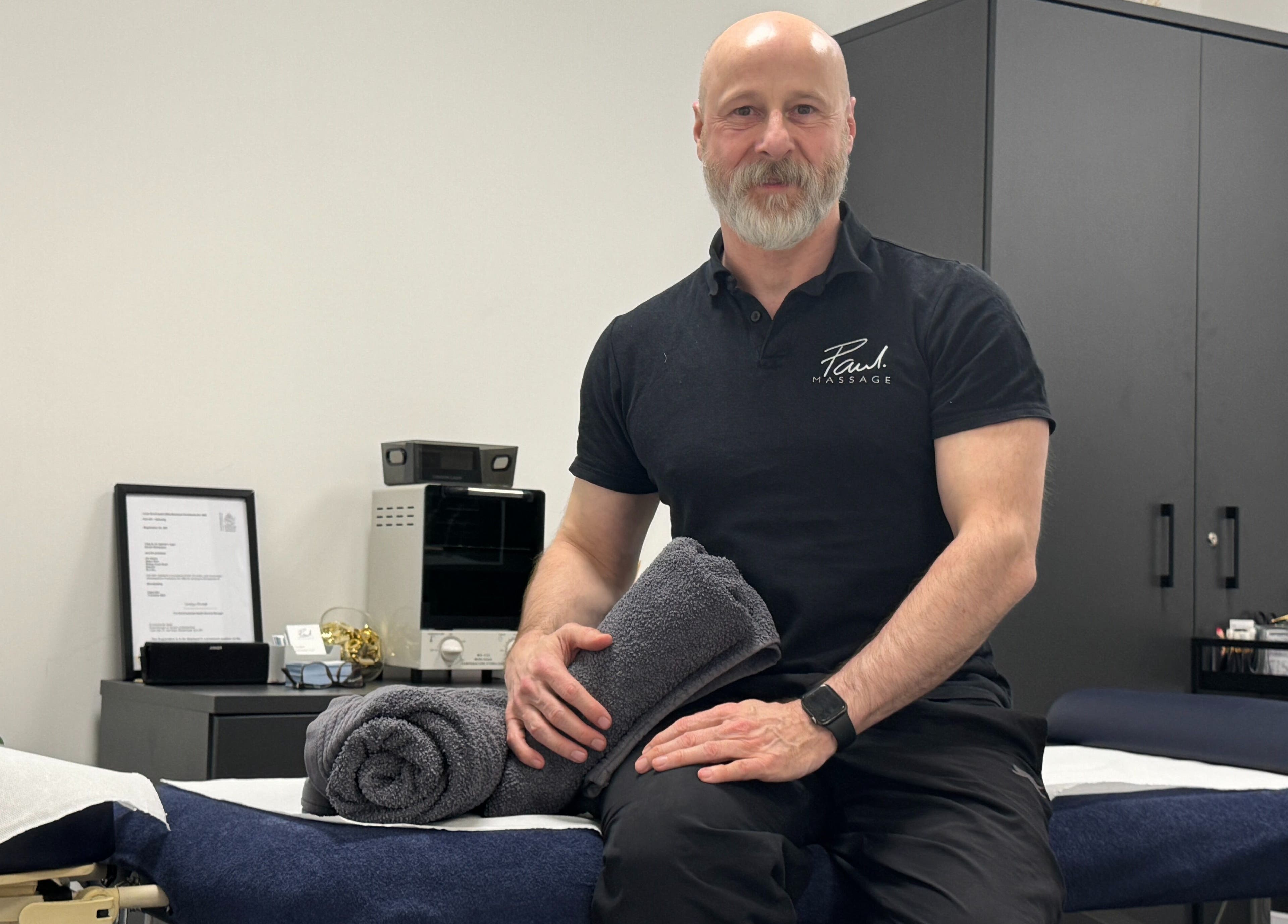 Paul Massage at Langley Leisure Centre, Slough, GB: masseur in a treatment room with towels.