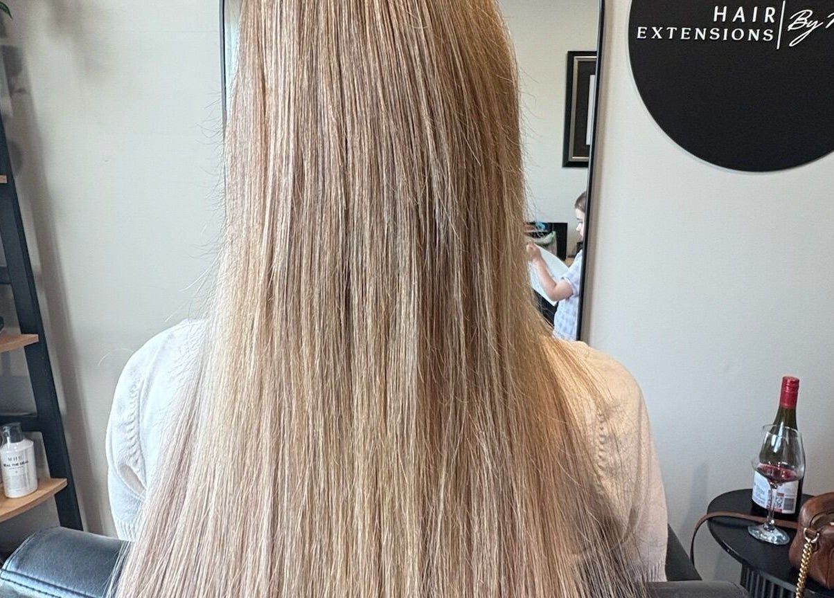 Lustrous blonde hair extensions at Hair Extensions by Natalie, Gisborne, Victoria, AU, creating a sleek look.