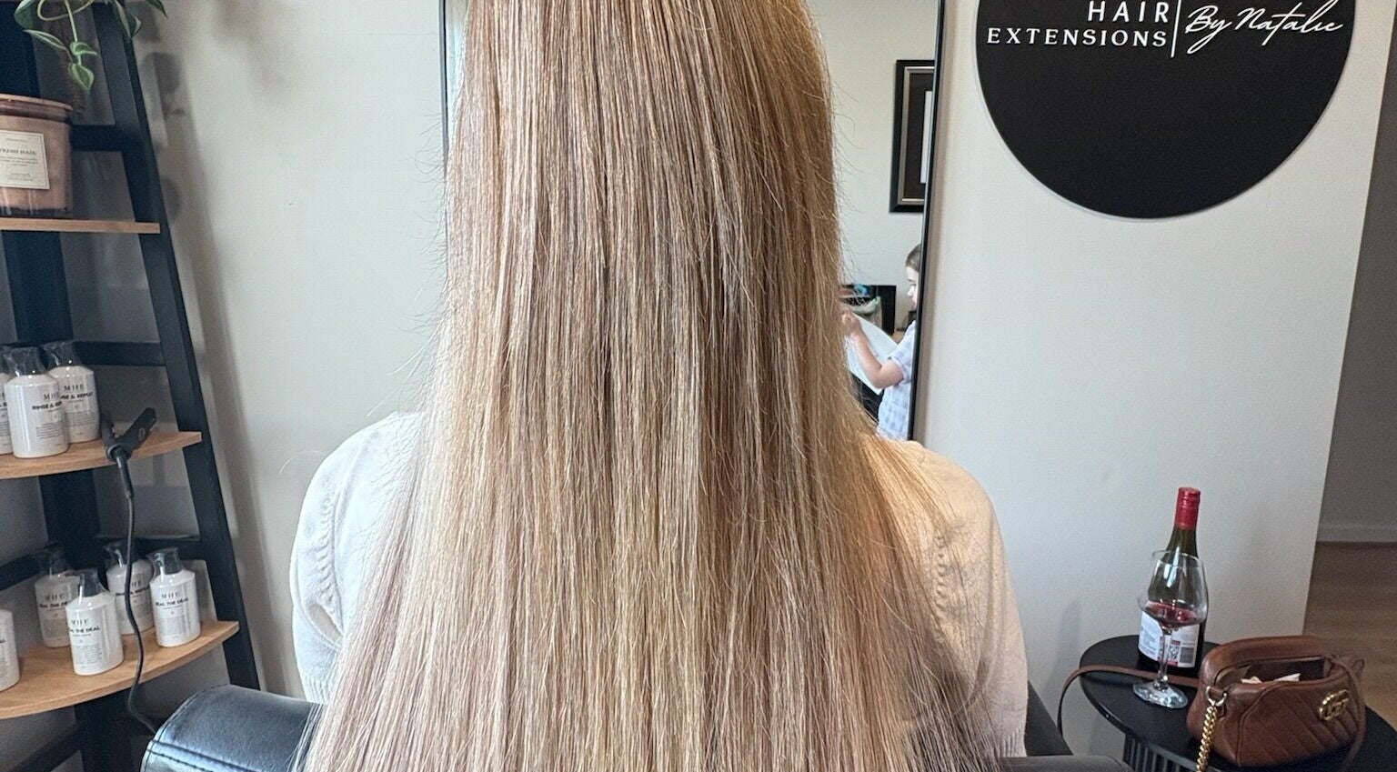 Lustrous blonde hair extensions at Hair Extensions by Natalie, Gisborne, Victoria, AU, creating a sleek look.