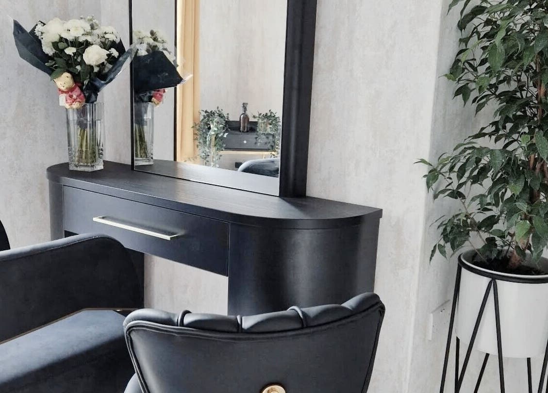 Elegant seating area at Brazilian Vibes Studio, London, England, GB with chic decor and greenery.