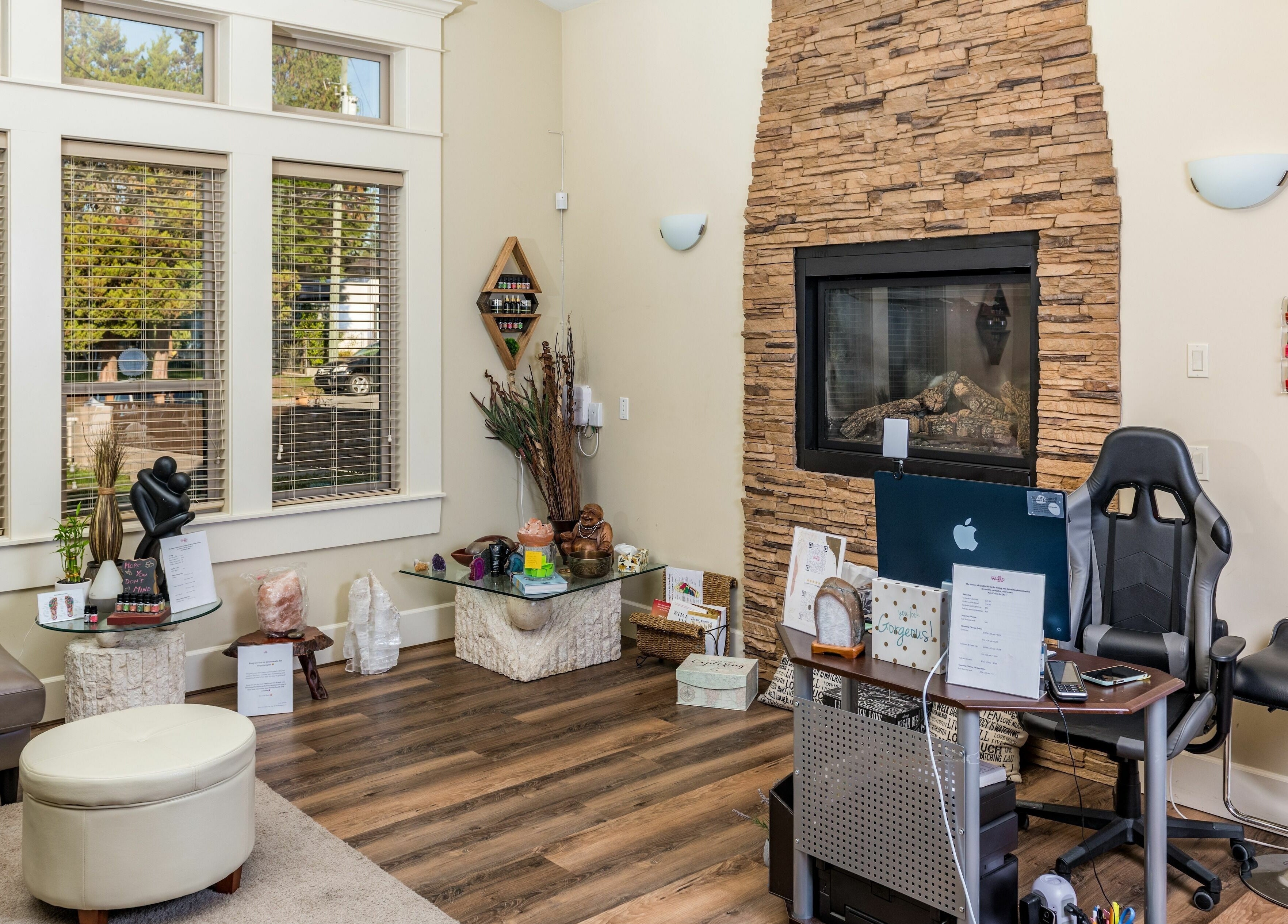 Inviting lounge at Kamal's Day Spa in Delta, British Columbia, CA featuring a relaxing atmosphere and stone fireplace.