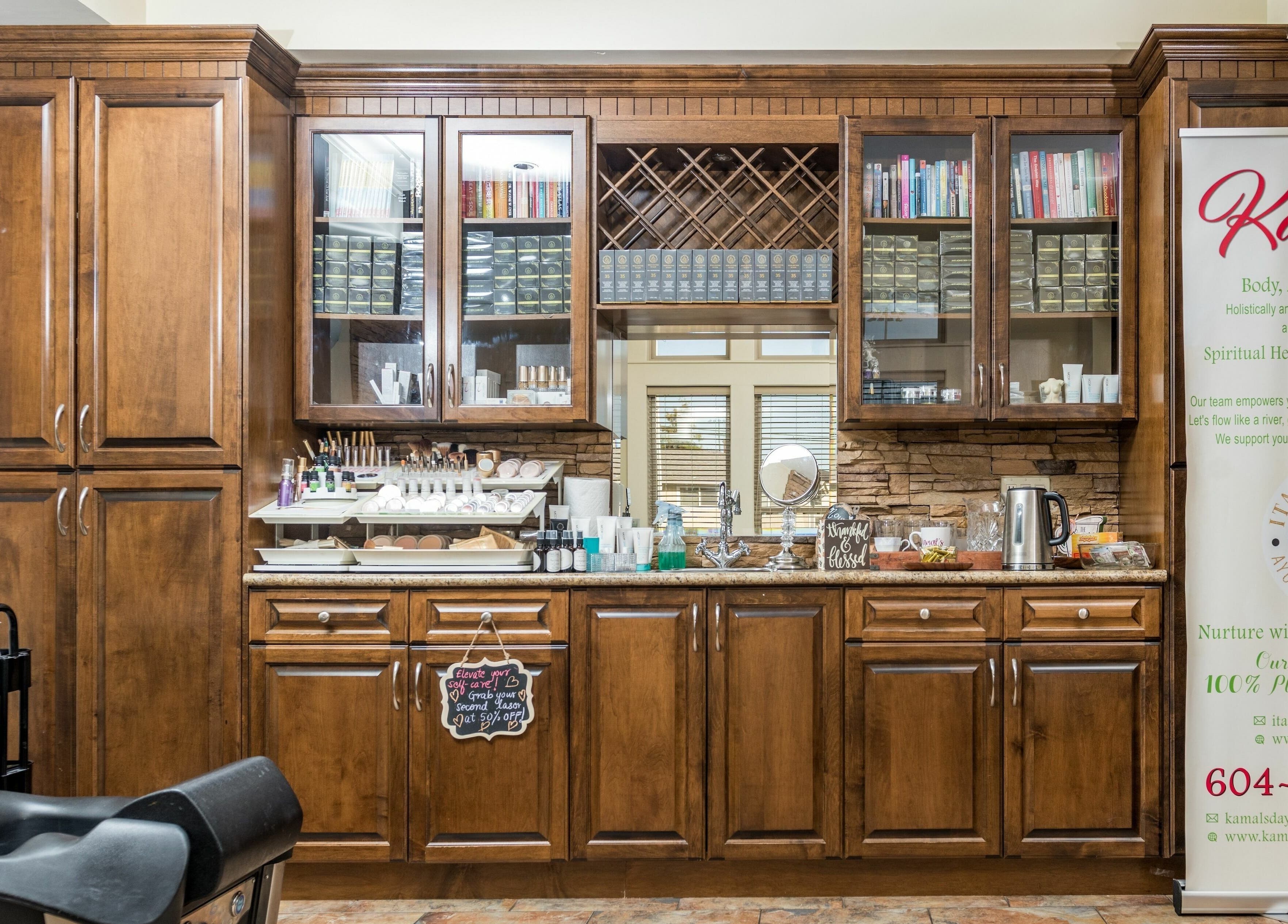 Sophisticated interior of Kamal's Day Spa in Delta, BC, featuring wooden cabinetry and beauty products.