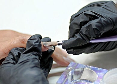 Professional nail artist at Nails by Metisha Pty(Ltd), Queensburgh, Kwazulu-Natal, ZA, applying acrylic nails.