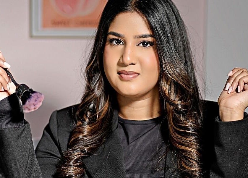 Makeup artist at The Beauty Spot, Queensburgh, Kwazulu-natal, ZA, holding a brush with confidence.