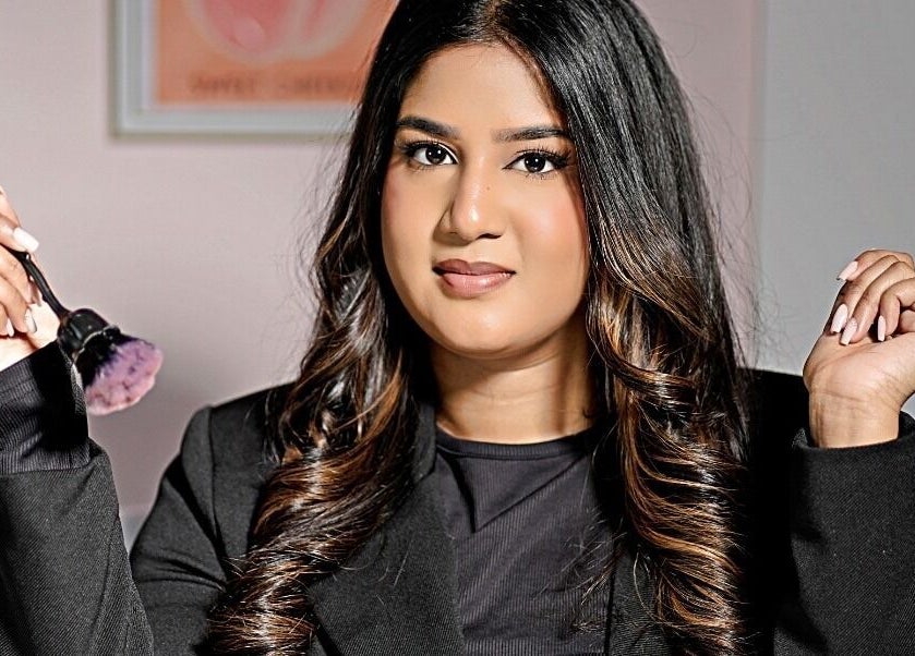 Makeup artist at The Beauty Spot, Queensburgh, Kwazulu-natal, ZA, holding a brush with confidence.