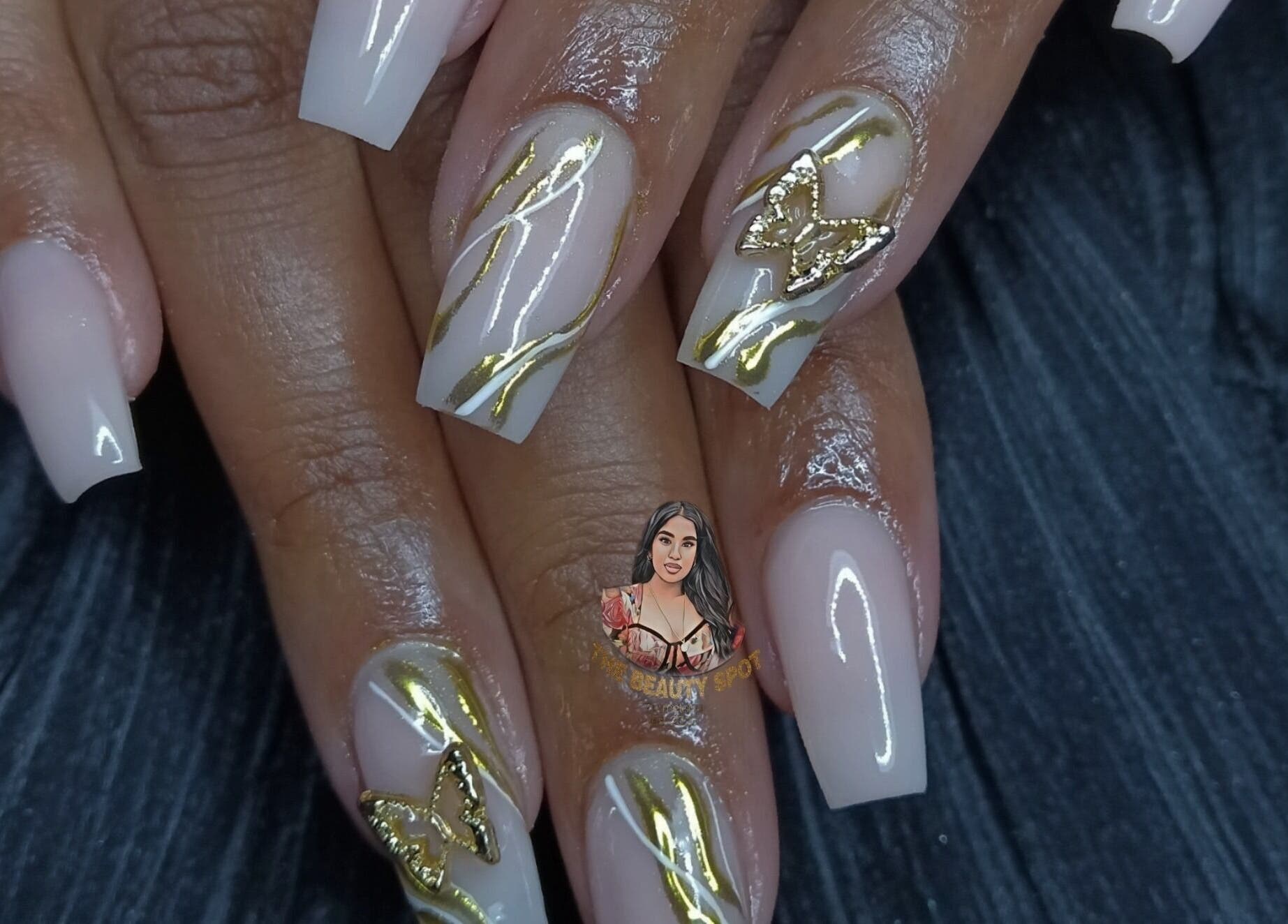 Elegant nail art with gold butterfly design at The Beauty spot at nailsby.metisha, Queensburgh, Kwazulu-natal, ZA.