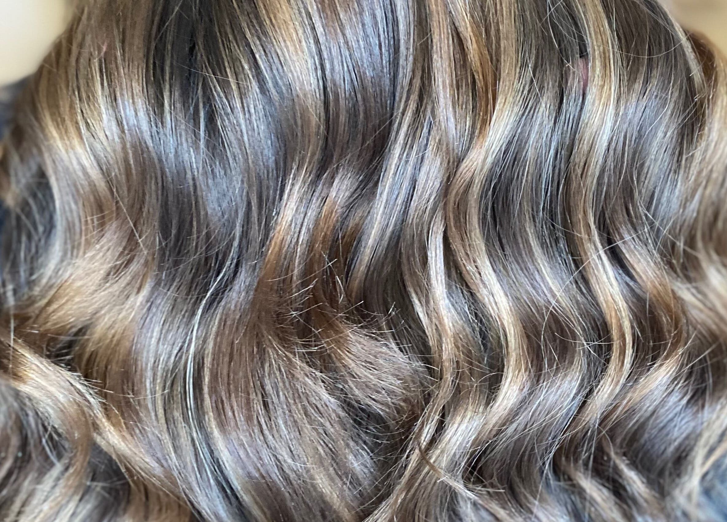 Shiny, styled wavy hair at G.C Hair, Crowthorne, England, GB salon, showcasing expert haircare.