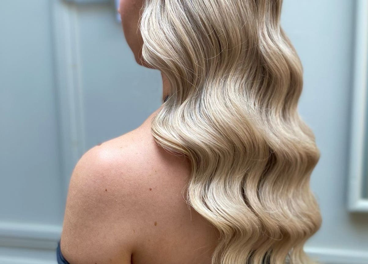 Elegant blonde waves styled at G.C Hair, Crowthorne, England, GB, showcasing luxurious texture.
