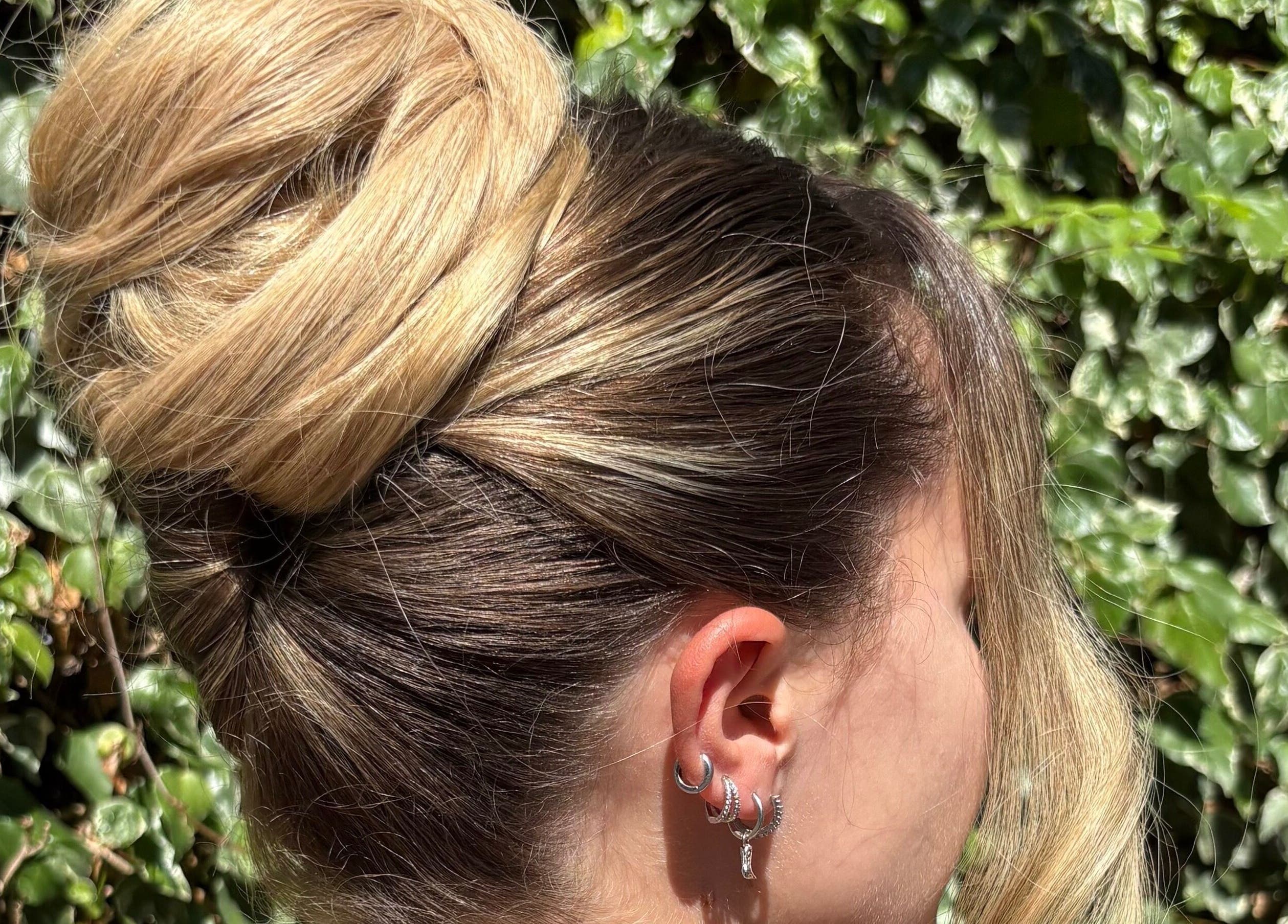 Elegant blonde updo hairstyle at G.C Hair, Crowthorne, England, GB, showcasing chic salon style.