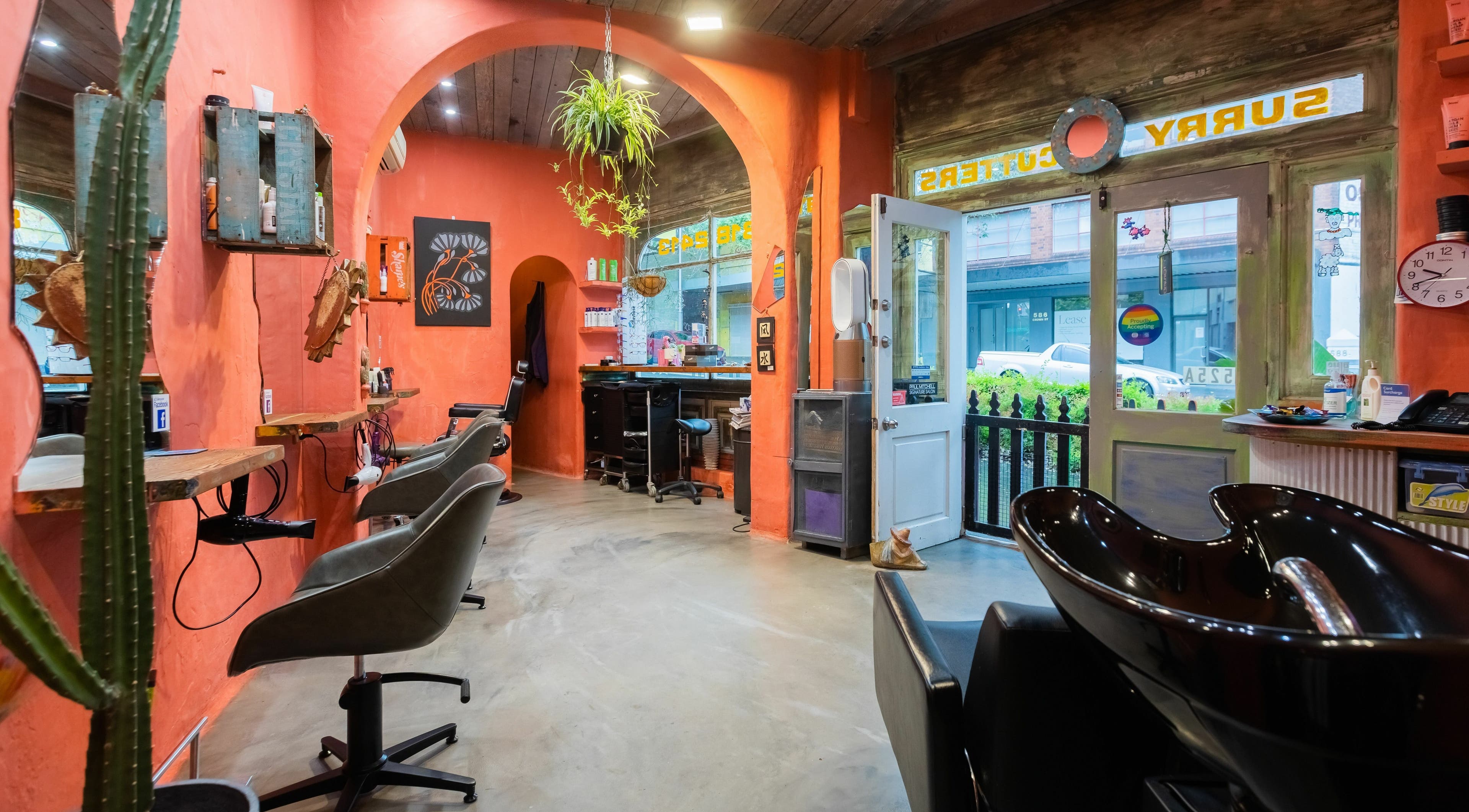 Stylish interior of Surry Cutters Hairdresser's in Surry Hills, New South Wales, AU with vibrant decor.