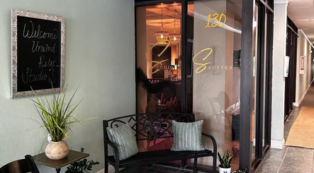 Entrance to Neblibana in Mulberry, Florida, US showcasing a cozy bench and welcoming decor.