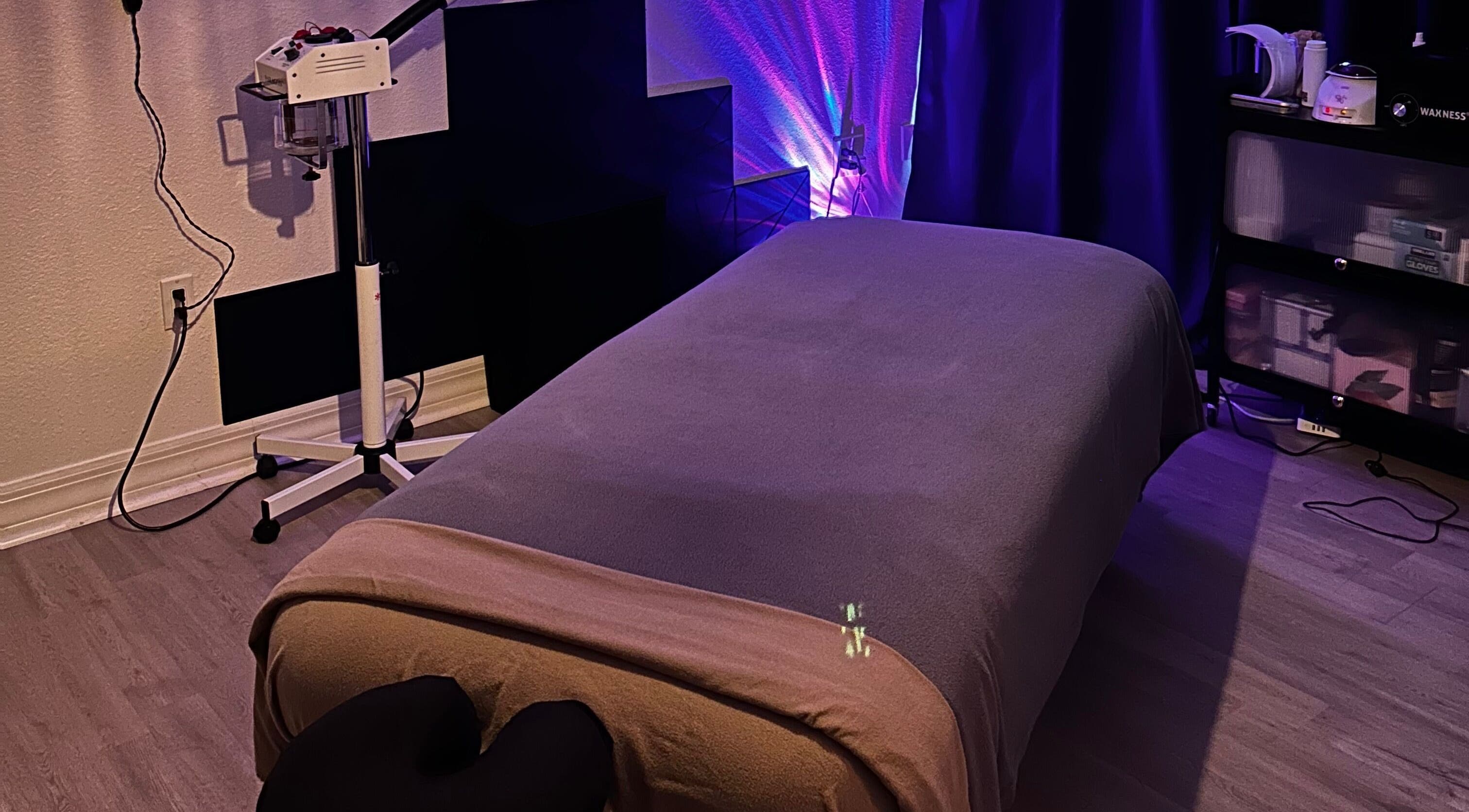 Relaxing massage room at Neblibana, Mulberry, Florida, US, featuring a comfortable massage table and calming lighting.