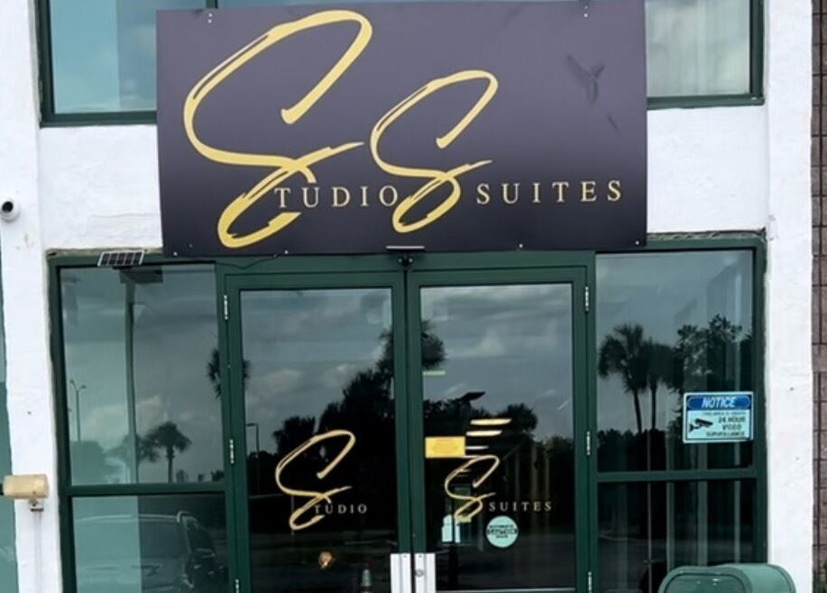 Entrance of Neblibana at Mulberry, Florida, US, showcasing modern glass doors and elegant signage.