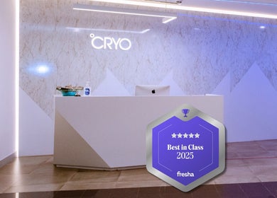 Reception area of °CRYO Dubai Emirates Towers, Dubai, featuring sleek design and awards display.