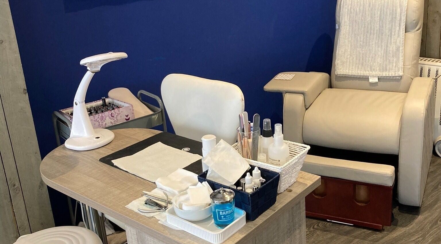 Nail care setup at Canvas, York, England, GB with a cozy chair and manicure tools.