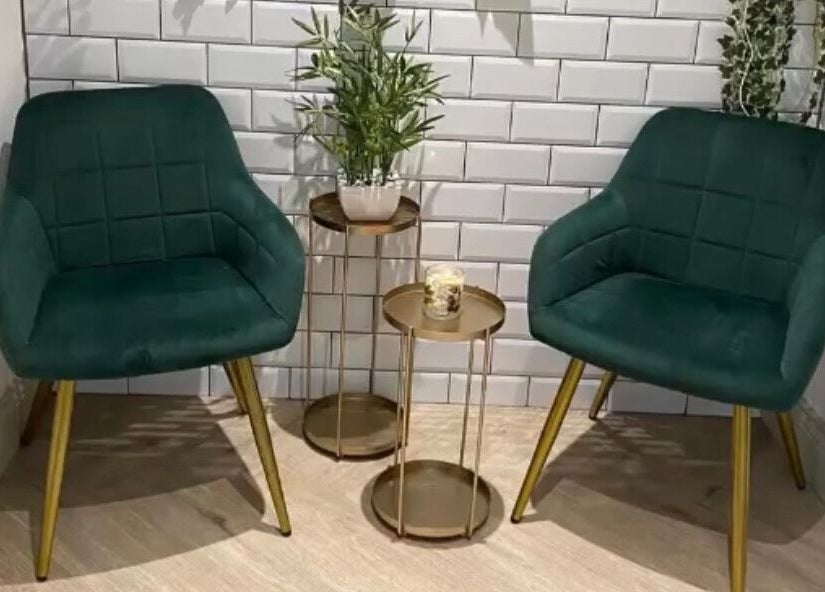 Elegant seating area with green chairs at Salon Cabello in Otley, England, GB.