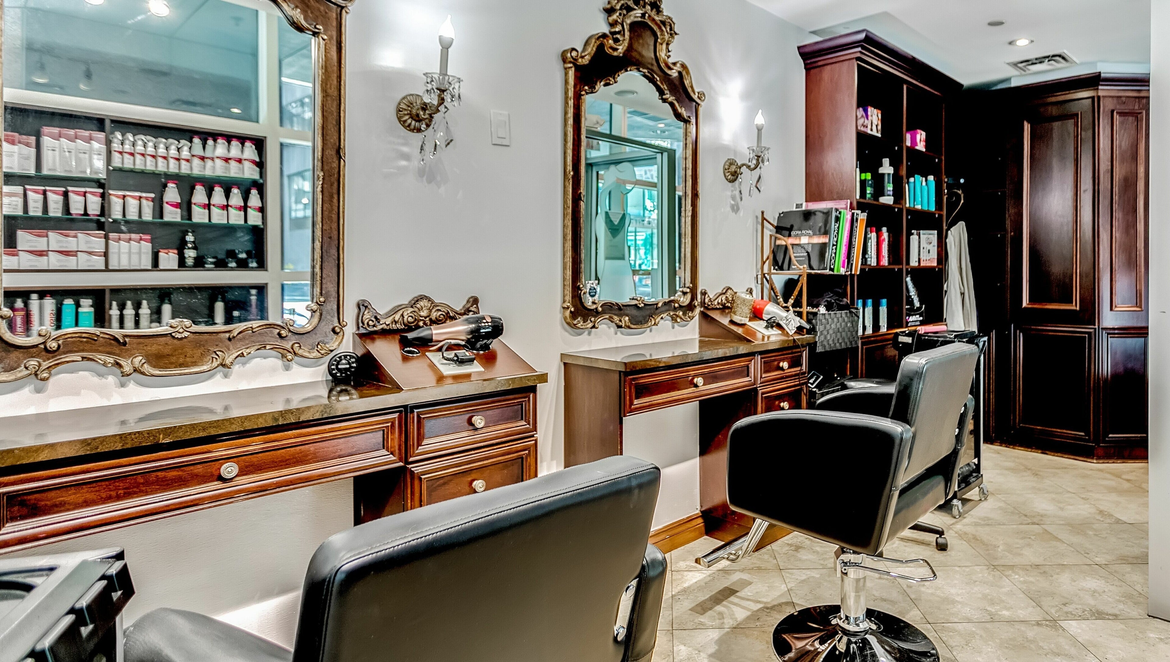 Chic salon chairs and ornate mirrors at La Jolie Femme Salon & Spa, Toronto, Ontario, CA.