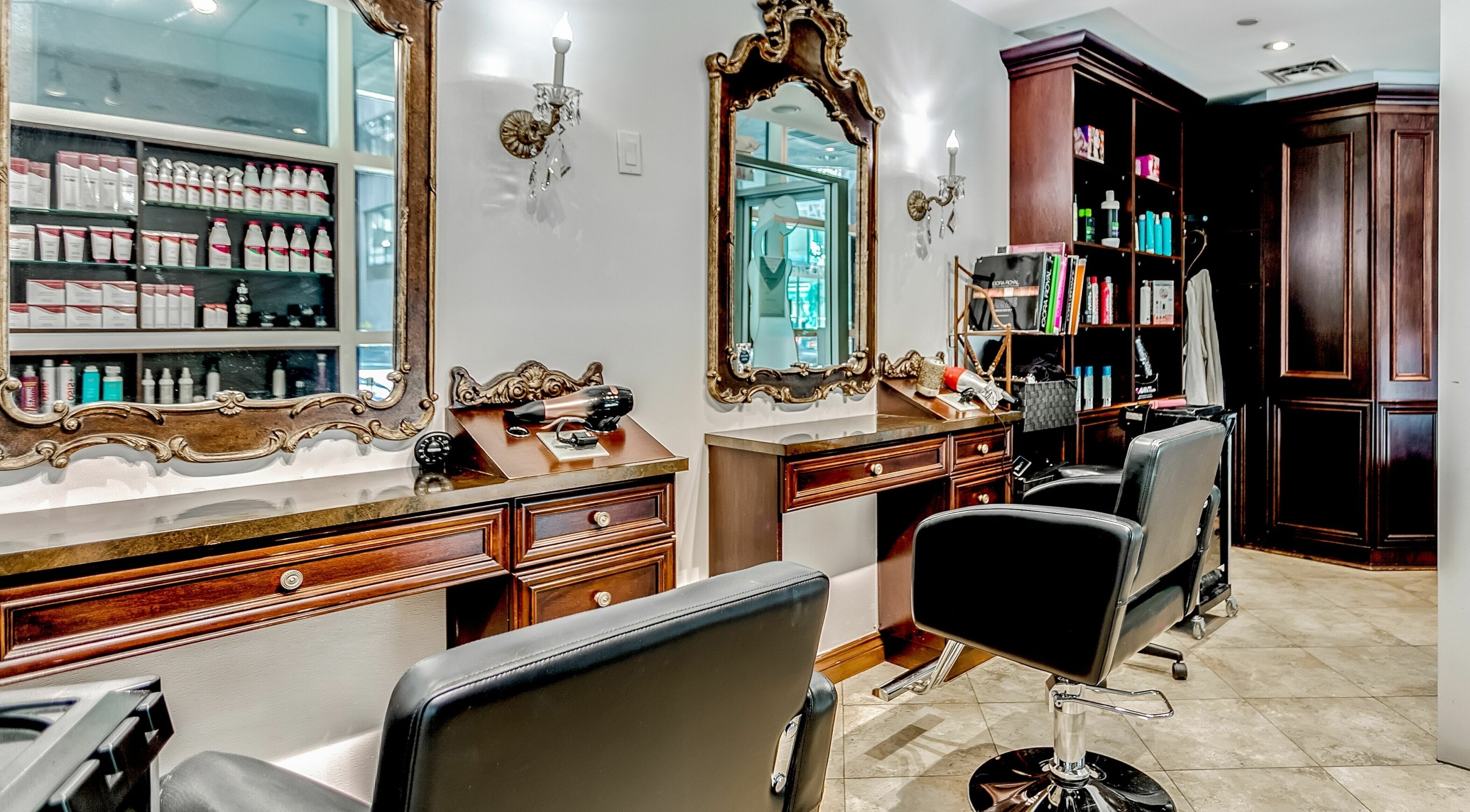 Chic salon chairs and ornate mirrors at La Jolie Femme Salon & Spa, Toronto, Ontario, CA.