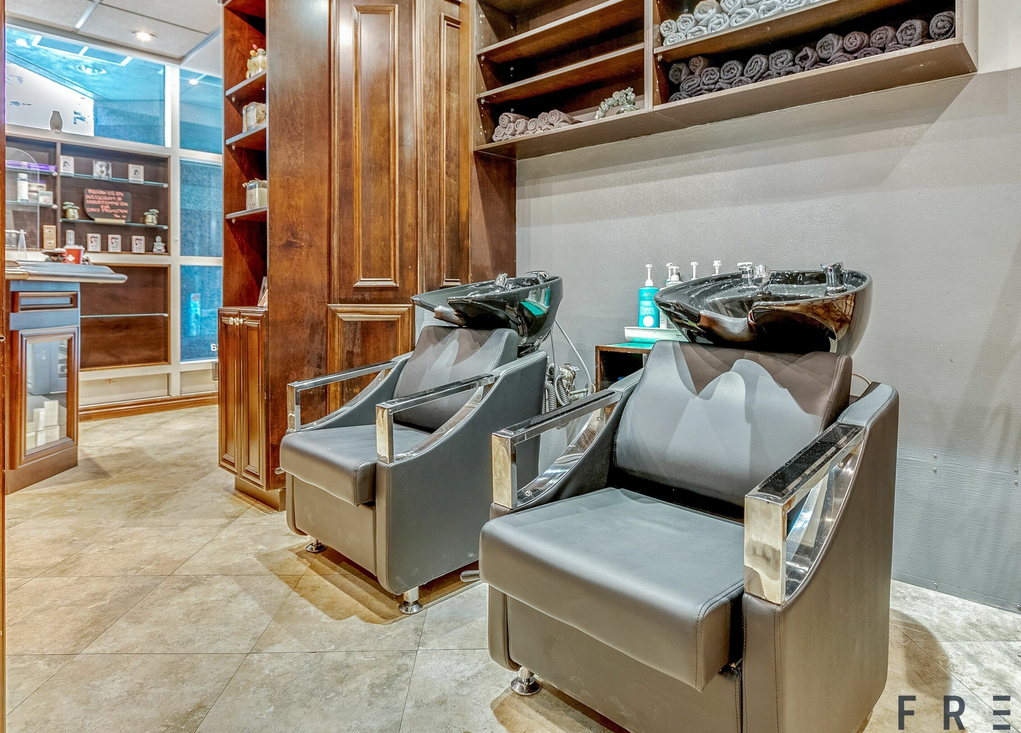 Luxurious hair washing area at La Jolie Femme Salon & Spa in Toronto, Ontario, CA, showcasing modern amenities.