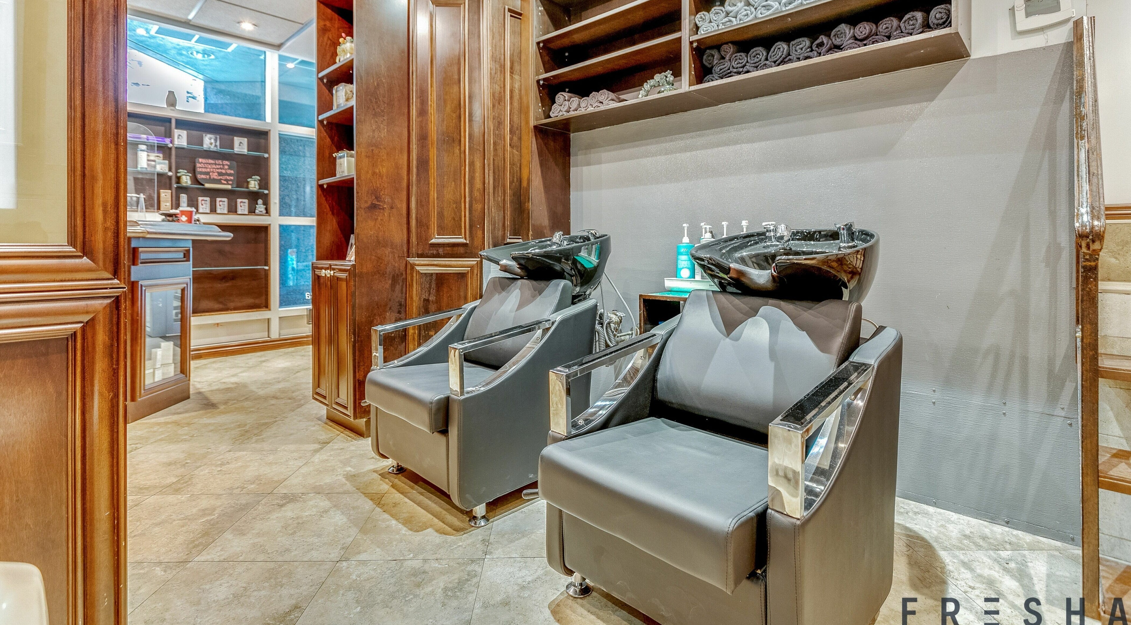 Luxurious hair washing area at La Jolie Femme Salon & Spa in Toronto, Ontario, CA, showcasing modern amenities.