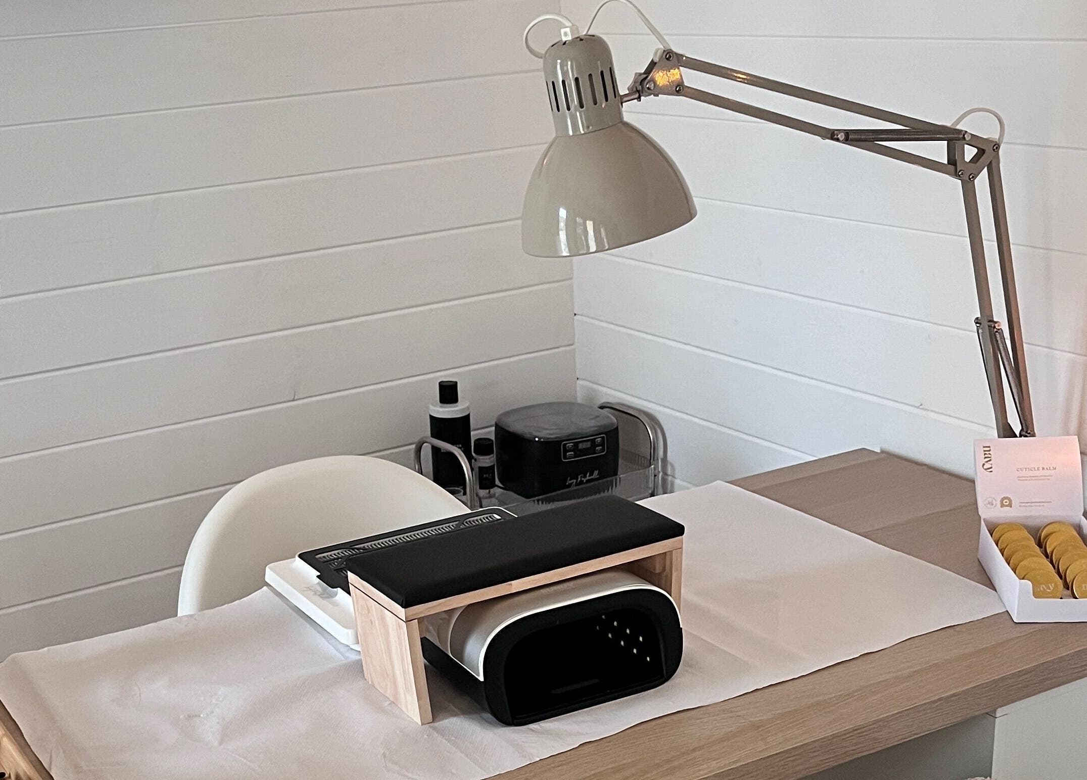 Modern nail station at Nailed it with Anna, Annfield Plain, England, GB, featuring a lamp and cozy decor.