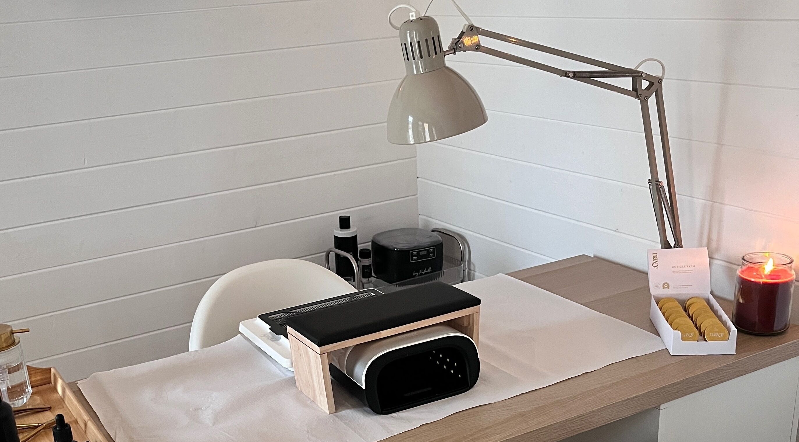 Modern nail station at Nailed it with Anna, Annfield Plain, England, GB, featuring a lamp and cozy decor.