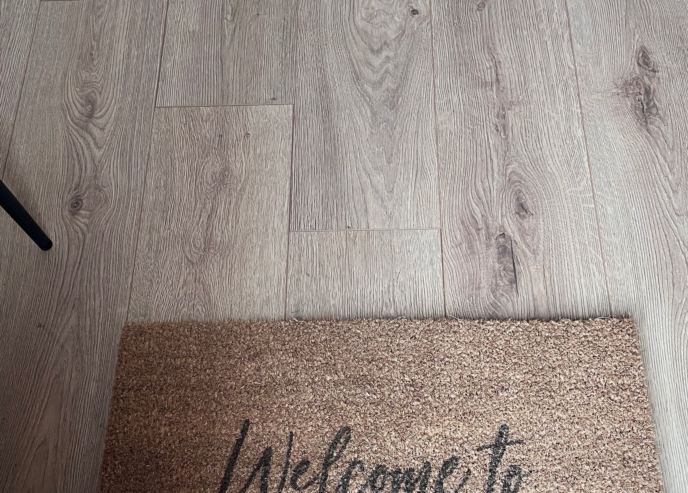 Welcome mat at 'Nailed it with Anna' in Annfield Plain, England, GB on elegant wooden floor.