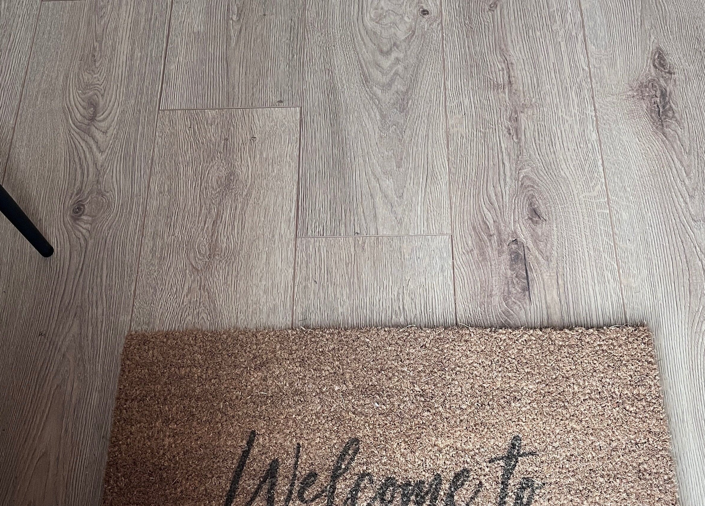 Welcome mat at 'Nailed it with Anna' in Annfield Plain, England, GB on elegant wooden floor.