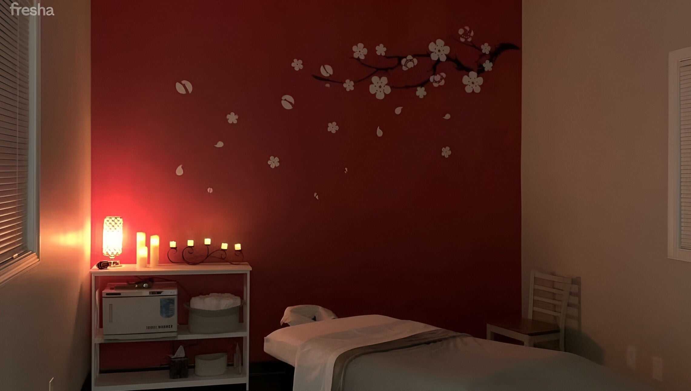 Relaxing massage room with warm lighting at Joyful Massage Day Spa LLC in Conyers, Georgia, US.