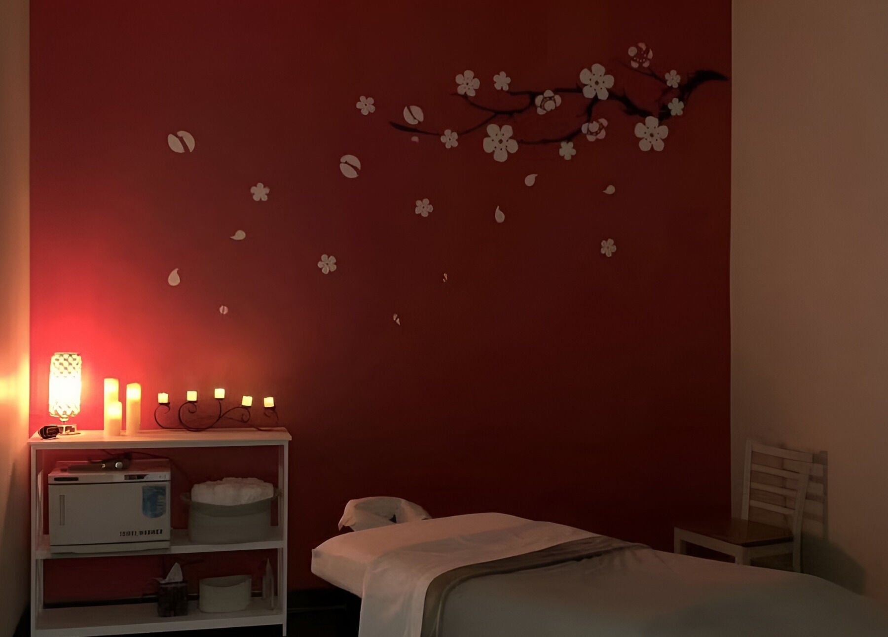 Relaxing massage room with warm lighting at Joyful Massage Day Spa LLC in Conyers, Georgia, US.