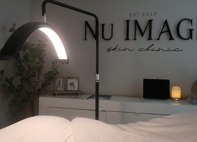 Relaxing treatment room at Nu Image, Lowton, England, GB with ambient lighting and tranquil decor.