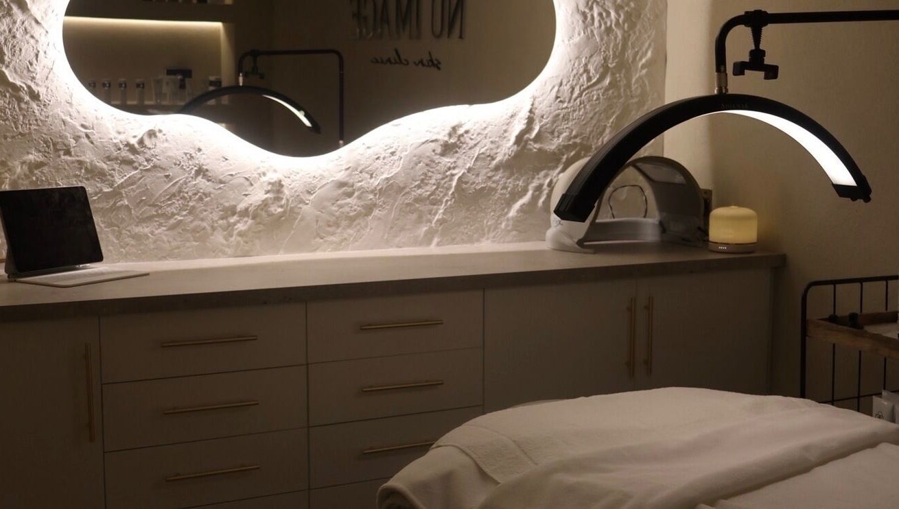 Relaxing spa room at Nu Image, Lowton, England, GB showcasing elegant design and soothing atmosphere.