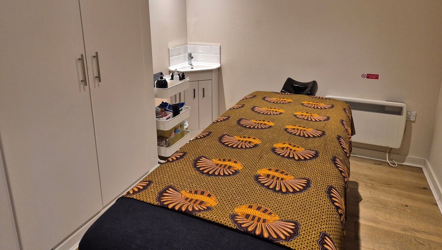 Tranquil therapy room at Ayma Therapeutics in London, England, GB, featuring a cozy massage table.