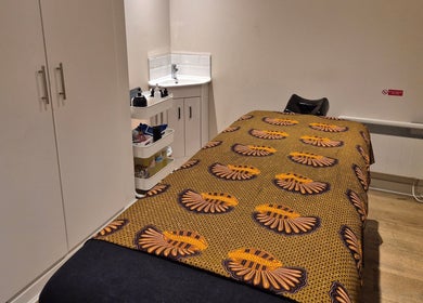 Tranquil therapy room at Ayma Therapeutics in London, England, GB, featuring a cozy massage table.