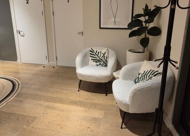 Modern chairs and decor in Ayma Therapeutics lounge, London, England, GB, offering a serene waiting area.