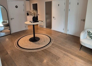 Elegant waiting area in Ayma Therapeutics, London, England, GB with modern decor and soft lighting.