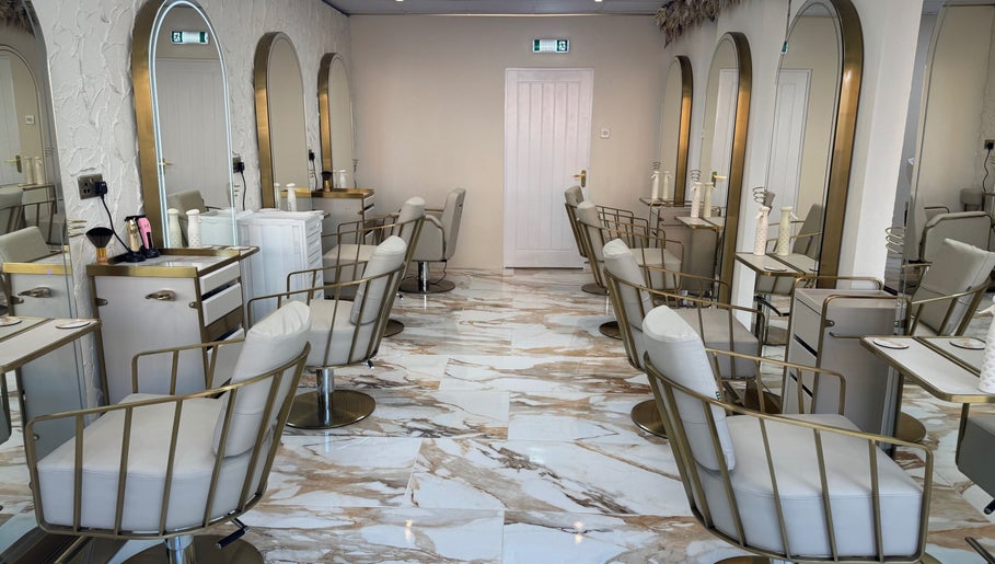 Sophie Lauren Studios in Derby, England, GB: chic salon interior with plush chairs and stylish mirrors.