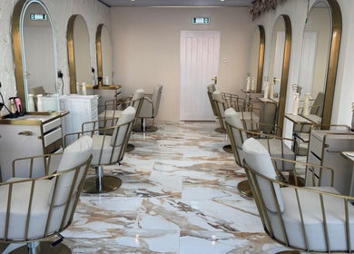Sophie Lauren Studios in Derby, England, GB: chic salon interior with plush chairs and stylish mirrors.