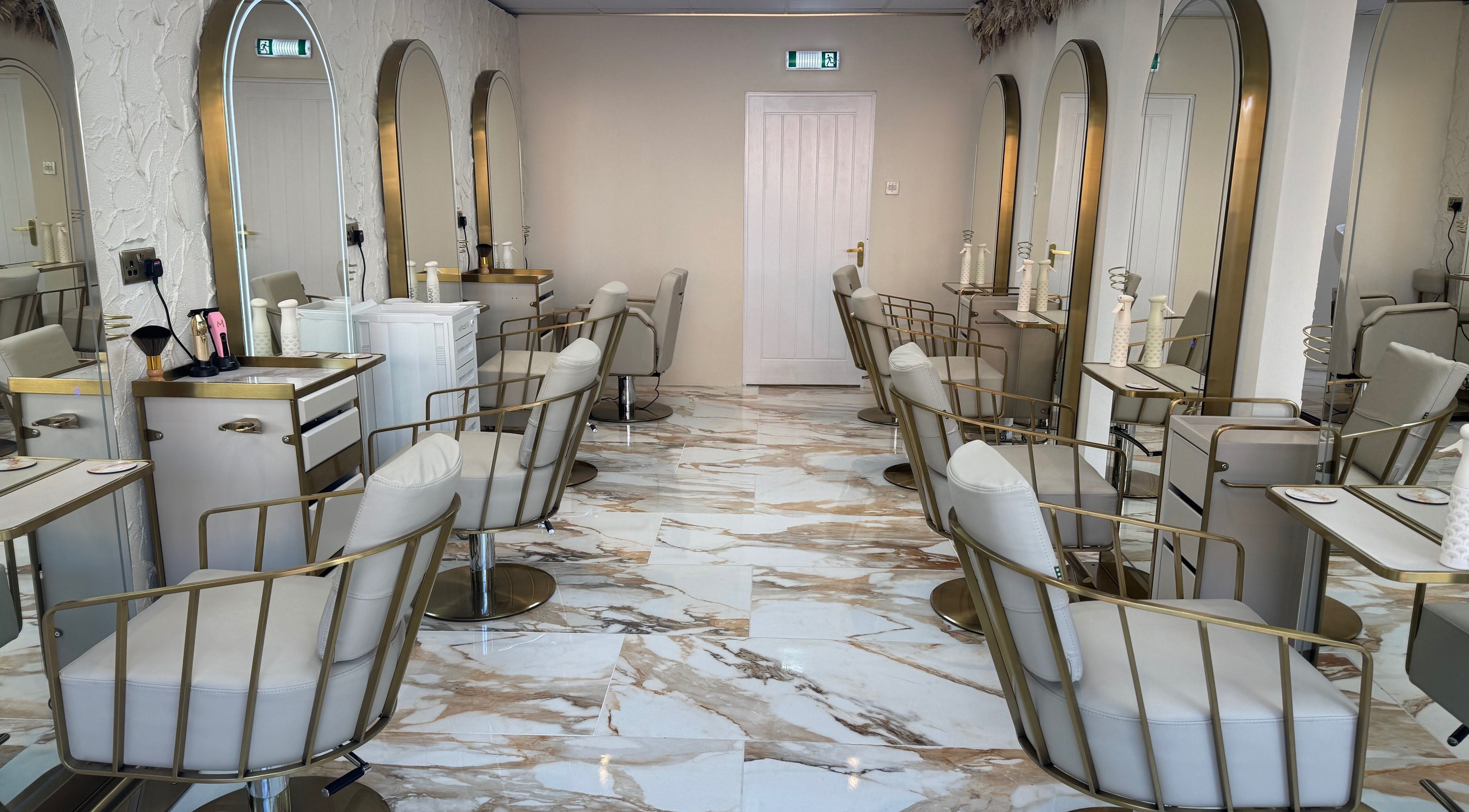 Sophie Lauren Studios in Derby, England, GB: chic salon interior with plush chairs and stylish mirrors.