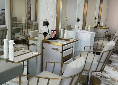 Luxurious salon chairs and mirrors at Sophie Lauren Studios in Derby, England, GB, showcasing refined beauty decor.