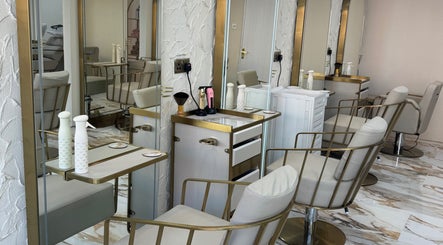 Luxurious salon chairs and mirrors at Sophie Lauren Studios in Derby, England, GB, showcasing refined beauty decor.
