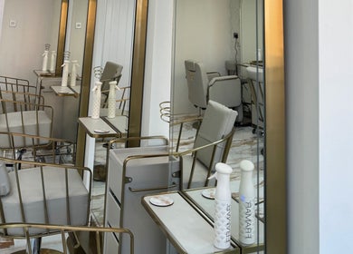 Stylish salon chairs and mirrors at Sophie Lauren Studios in Derby, England, GB highlight a modern elegance.