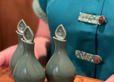 Ceramic oil bottles at Siam Botanical Thai Massage, Melbourne, Victoria, AU, enhancing relaxation ambiance.