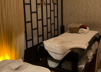 Cozy massage room at Siam Botanical Thai Massage in Melbourne, Victoria, AU with soft lighting and plush decor.