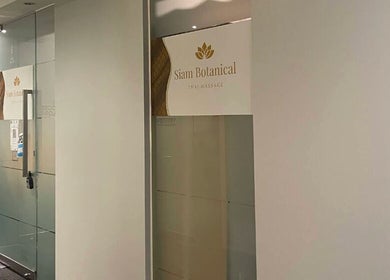 Entrance of Siam Botanical Thai Massage, Melbourne, Victoria, AU with elegant glass doors and signage.