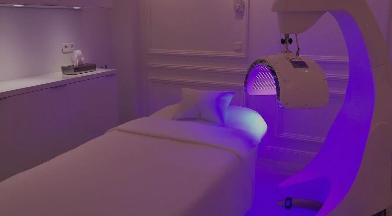 Treatment room at Elle Esthetics: Ashbourne Skin & Laser Clinic in Ashbourne, County Meath, IE with ambient lighting.