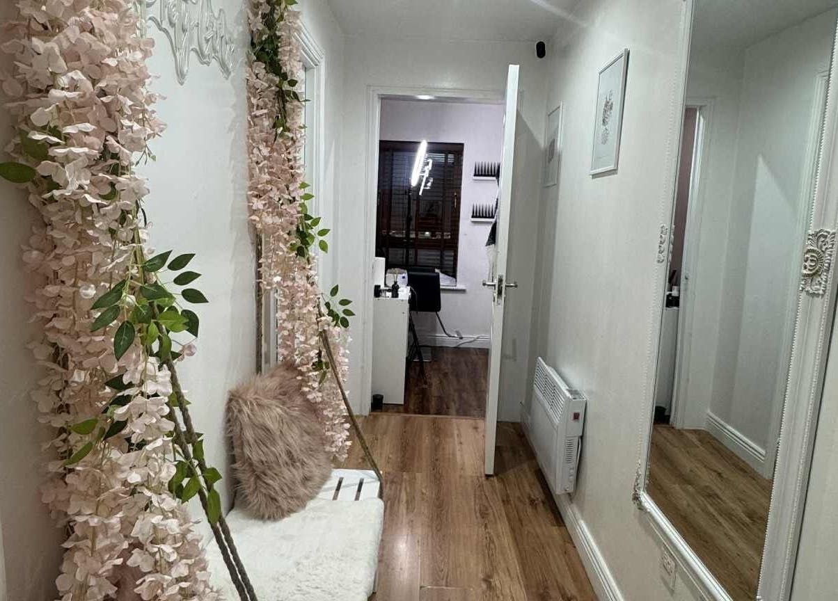 Elegant hallway of Elle Esthetics: Ashbourne Skin & Laser Clinic, Ashbourne, County Meath, IE with floral decor.
